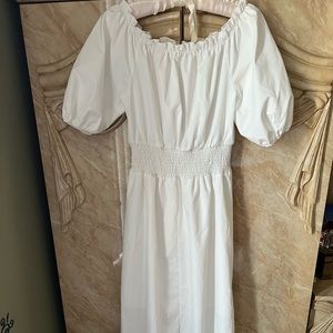 Woman white of shoulder dress